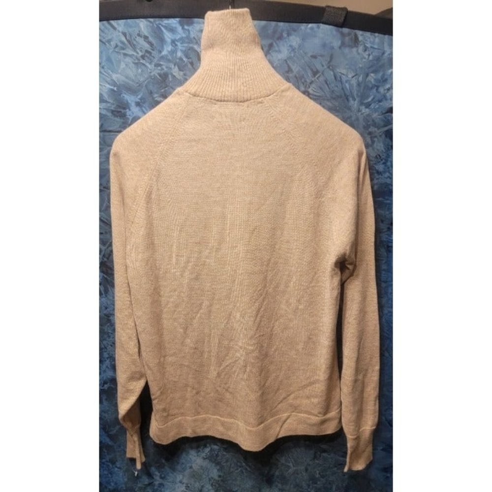 Beige sweater.